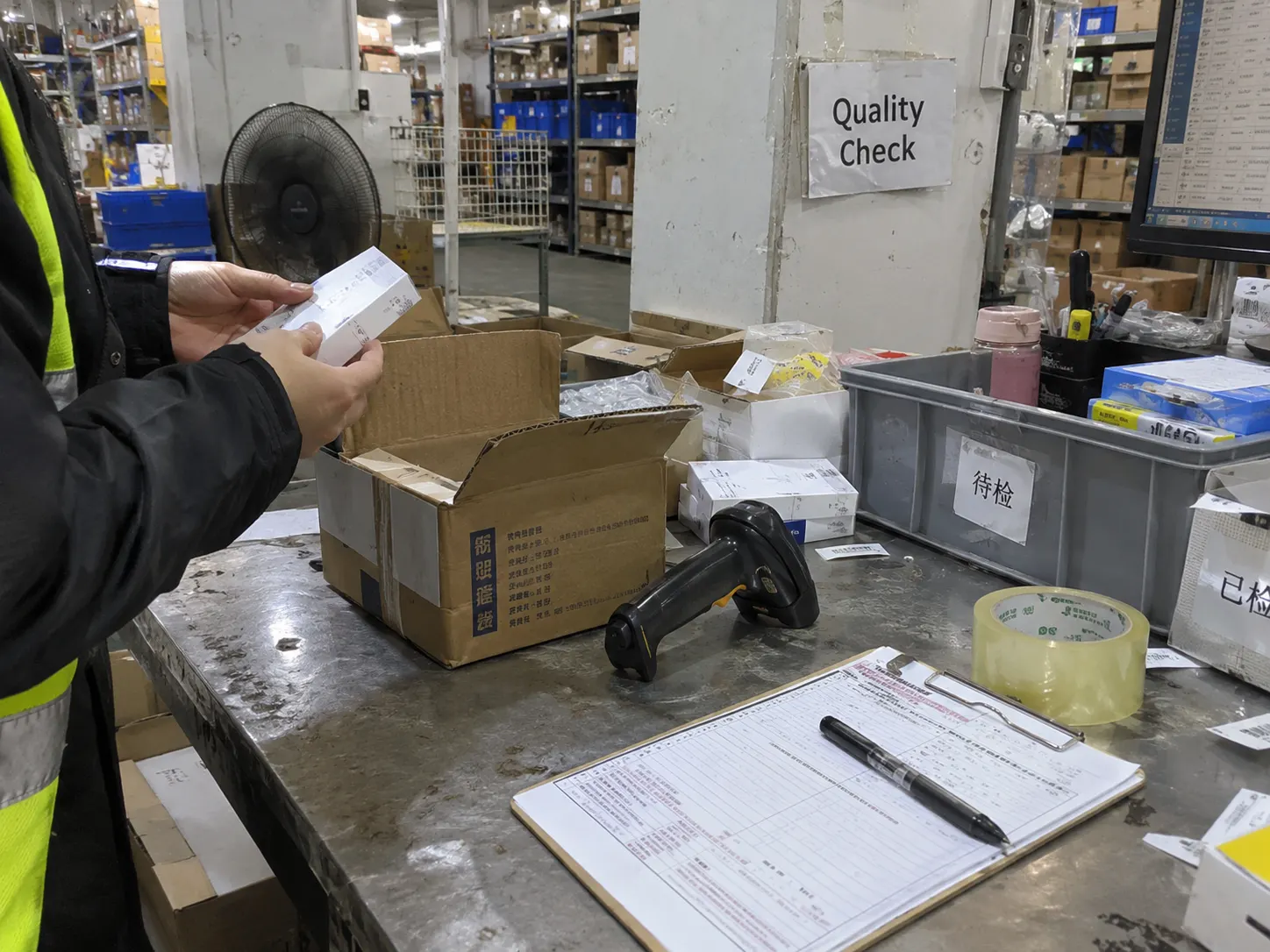 Illustration of a quality check station where a product is inspected before it is packed